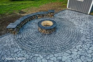 concrete patio and fireplace