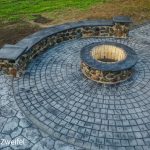concrete patio and fireplace