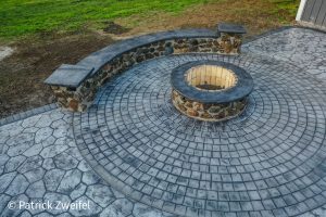 concrete patio and fireplace