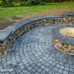 cobblestone patio with fireplace
