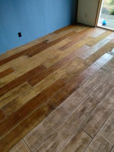 concrete wood planked floor inside house