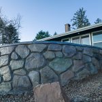 Custom Cut Ashlar Pattern & 13′ Medallion with Random Stone Concrete Retaining Wall