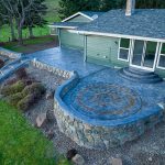 Custom Cut Ashlar Pattern & 13′ Medallion with Random Stone Concrete Retaining Wall