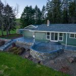 Custom Cut Ashlar Pattern & 13′ Medallion with Random Stone Concrete Retaining Wall