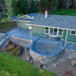 Custom Cut Ashlar Pattern & 13′ Medallion with Random Stone Concrete Retaining Wall