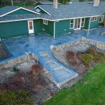 Custom Cut Ashlar Pattern & 13′ Medallion with Random Stone Concrete Retaining Wall