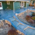 Custom Cut Ashlar Pattern & 13′ Medallion with Random Stone Concrete Retaining Wall