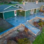 Custom Cut Ashlar Pattern & 13′ Medallion with Random Stone Concrete Retaining Wall