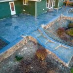 Custom Cut Ashlar Pattern & 13′ Medallion with Random Stone Concrete Retaining Wall