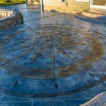 Custom Cut Ashlar Pattern & 13′ Medallion with Random Stone Concrete Retaining Wall