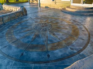 Custom Cut Ashlar Pattern & 13′ Medallion with Random Stone Concrete Retaining Wall