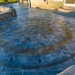 Custom Cut Ashlar Pattern & 13′ Medallion with Random Stone Concrete Retaining Wall