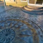 Custom Cut Ashlar Pattern & 13′ Medallion with Random Stone Concrete Retaining Wall