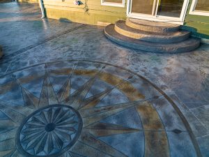Custom Cut Ashlar Pattern & 13′ Medallion with Random Stone Concrete Retaining Wall