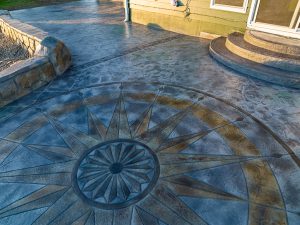 Custom Cut Ashlar Pattern & 13′ Medallion with Random Stone Concrete Retaining Wall