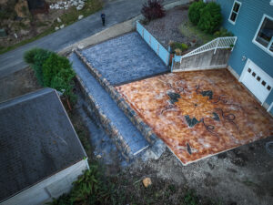cobblestone conrete driveway, retaining wall, acid stain rockaway oregon