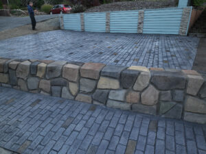 cobblestone conrete driveway, retaining wall, acid stain rockaway oregon
