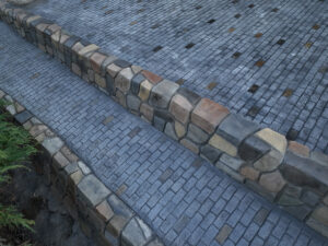 cobblestone conrete driveway, retaining wall, acid stain rockaway oregon