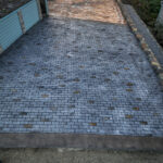 cobblestone conrete driveway, retaining wall, acid stain rockaway oregon