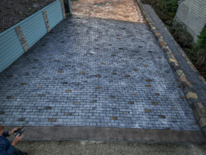 cobblestone conrete driveway, retaining wall, acid stain rockaway oregon