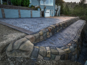 cobblestone conrete driveway, retaining wall, acid stain rockaway oregon