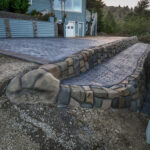 cobblestone conrete driveway, retaining wall, acid stain rockaway oregon