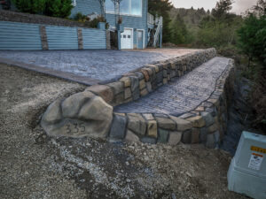 cobblestone conrete driveway, retaining wall, acid stain rockaway oregon
