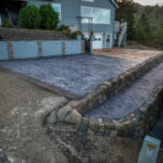 cobblestone conrete driveway, retaining wall, acid stain rockaway oregon