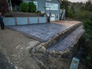 cobblestone conrete driveway, retaining wall, acid stain rockaway oregon