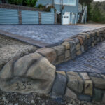 cobblestone conrete driveway, retaining wall, acid stain rockaway oregon