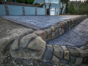 cobblestone conrete driveway, retaining wall, acid stain rockaway oregon