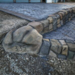 cobblestone conrete driveway, retaining wall, acid stain rockaway oregon