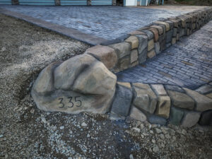 cobblestone conrete driveway, retaining wall, acid stain rockaway oregon