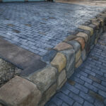 cobblestone conrete driveway, retaining wall, acid stain rockaway oregon