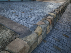 cobblestone conrete driveway, retaining wall, acid stain rockaway oregon