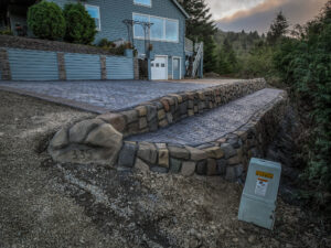 cobblestone conrete driveway, retaining wall, acid stain rockaway oregon