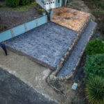 cobblestone conrete driveway, retaining wall, acid stain rockaway oregon