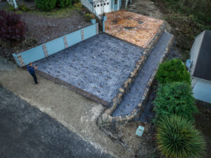 cobblestone conrete driveway, retaining wall, acid stain rockaway oregon
