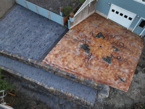 cobblestone conrete driveway, retaining wall, acid stain rockaway oregon