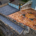 cobblestone conrete driveway, retaining wall, acid stain rockaway oregon