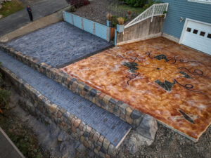 cobblestone conrete driveway, retaining wall, acid stain rockaway oregon