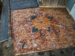 cobblestone conrete driveway, retaining wall, acid stain rockaway oregon