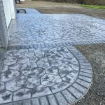 random stone brick border colored concrete driveway oregon