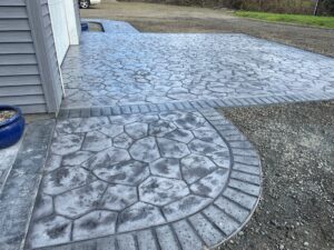 random stone brick border colored concrete driveway oregon