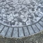 random stone brick border colored concrete driveway oregon
