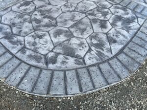 random stone brick border colored concrete driveway oregon