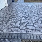 random stone brick border colored concrete driveway oregon
