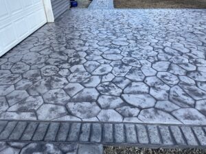 random stone brick border colored concrete driveway oregon