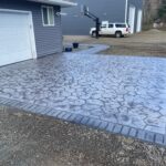 random stone brick border colored concrete driveway oregon