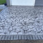 random stone brick border colored concrete driveway oregon